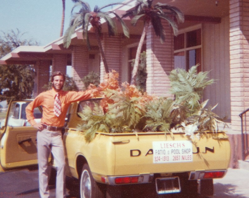 Untitled-3.jpg - I'm going to guess by the lack of a license plate that this 1972 Datsun was brand new here.  The setting is just outside of the Bakersfield Country Club and I remember that I wsa delivering and setting up this plastic greenery that Liesch's Patio and Pool Shop rented out for parties and such.